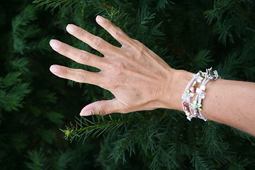 Image showing Hand and bracelet