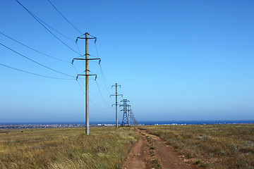 Image showing row of electricity pillons