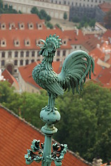 Image showing Prague tile roofs and cock on a church tower