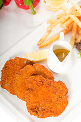 Image showing classic Milanese veal cutlets and vegetables