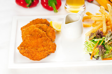 Image showing classic Milanese veal cutlets and vegetables