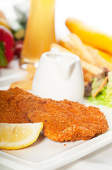 Image showing classic Milanese veal cutlets and vegetables