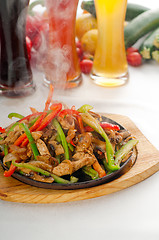 Image showing original fajita sizzling hot  on iron plate