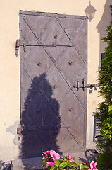 Image showing Ancient metal door with locked padlock ornament.