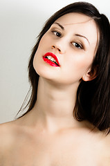 Image showing oung fashion model with white skin and red lipstick