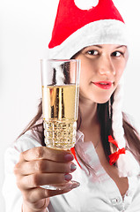 Image showing Young woman in red hat waiting for the new year