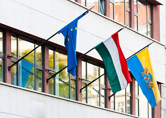 Image showing Flags of some countries on an office building