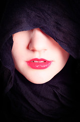 Image showing Part of a woman's face with black hood