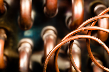 Image showing Close up of orange wires and pipes