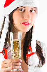 Image showing Young woman in red hat waiting for the new year