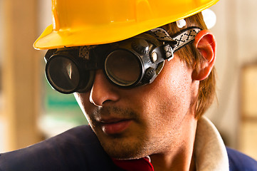 Image showing An industrial worker in protective suit