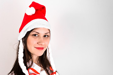 Image showing Young woman in red hat waiting for the new year