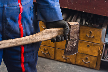 Image showing Man holding industrial axe