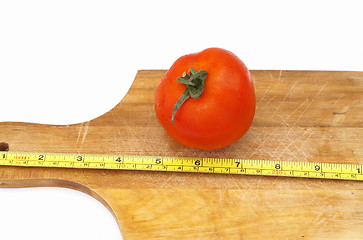 Image showing Measure a tomato