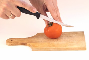 Image showing Cutting a tomato