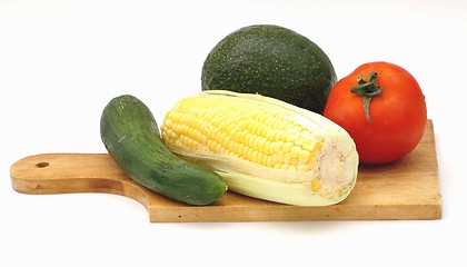 Image showing Vegetables on a wooden plate