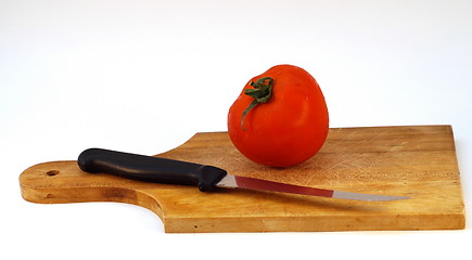 Image showing Cutting a tomato