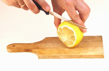 Image showing Cutting a lemon