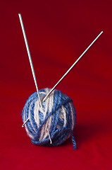 Image showing Ball of yarn and knitting skewers