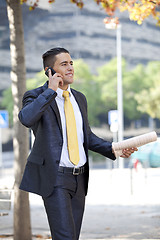 Image showing Businessman walking at the city park