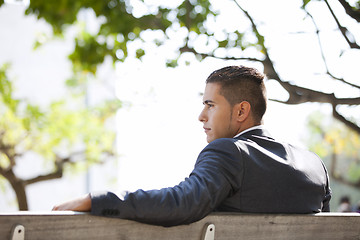 Image showing Businessman sit in the bench park