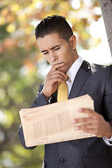 Image showing Businessman reading the newspaper