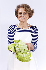 Image showing Senior woman with a sprout