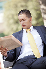 Image showing Businessman reading the newspaper