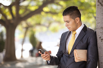 Image showing Businessman sending messages at the cellular