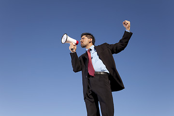 Image showing Businessman speaking with a megaphone