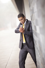 Image showing Security Businessman with a handgun