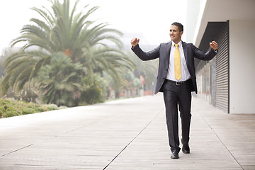 Image showing Confident businessman walking