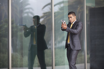 Image showing Security Businessman with a handgun