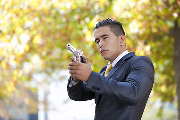 Image showing Security Businessman with a handgun