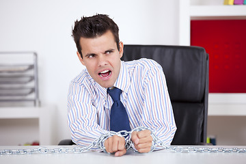 Image showing Businessman captive at his office