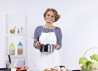 Image showing Senior woman cooking