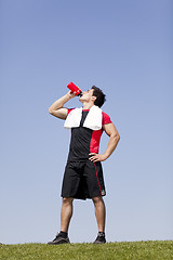 Image showing man refreshing after the exercise