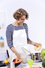 Image showing Senior woman cooking