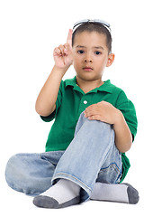 Image showing boy with one finger raised