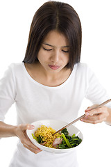 Image showing asian woman eating with chop sticks