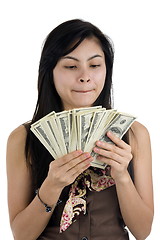 Image showing pretty woman with lots of money