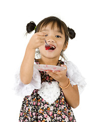 Image showing cute girl having sweet dessert