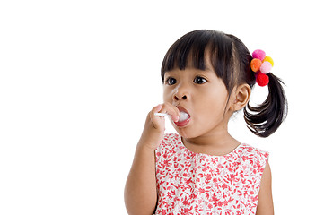 Image showing cute little girl with a lollipop