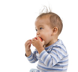 Image showing cute boy eating an apple