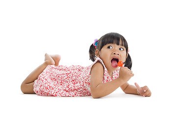 Image showing cute little girl with a lollipop