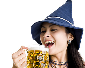 Image showing beautiful woman celebrating with beer