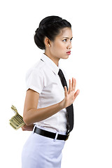 Image showing woman hiding money