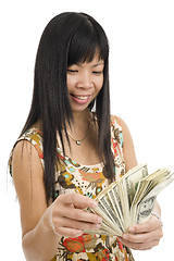 Image showing happy woman counting money