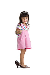 Image showing little girl with oversized shoes