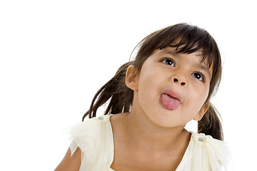 Image showing beautiful little girl sticking her tongue out